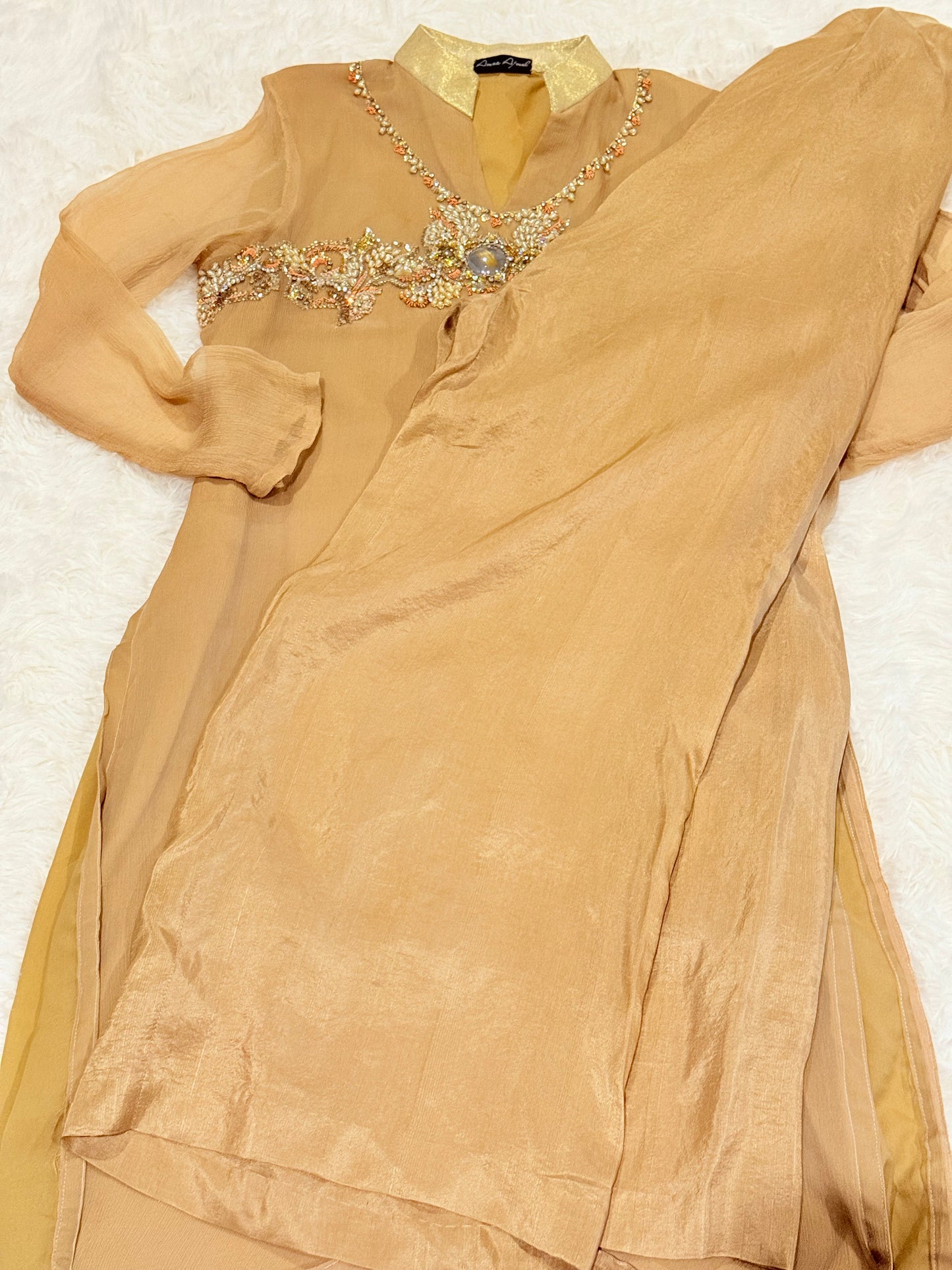 Amna Ajmal Couture Chiffon Lux Shirt in Beige color with heavy stone embellishments, comes with matching wide leg trouser in silk