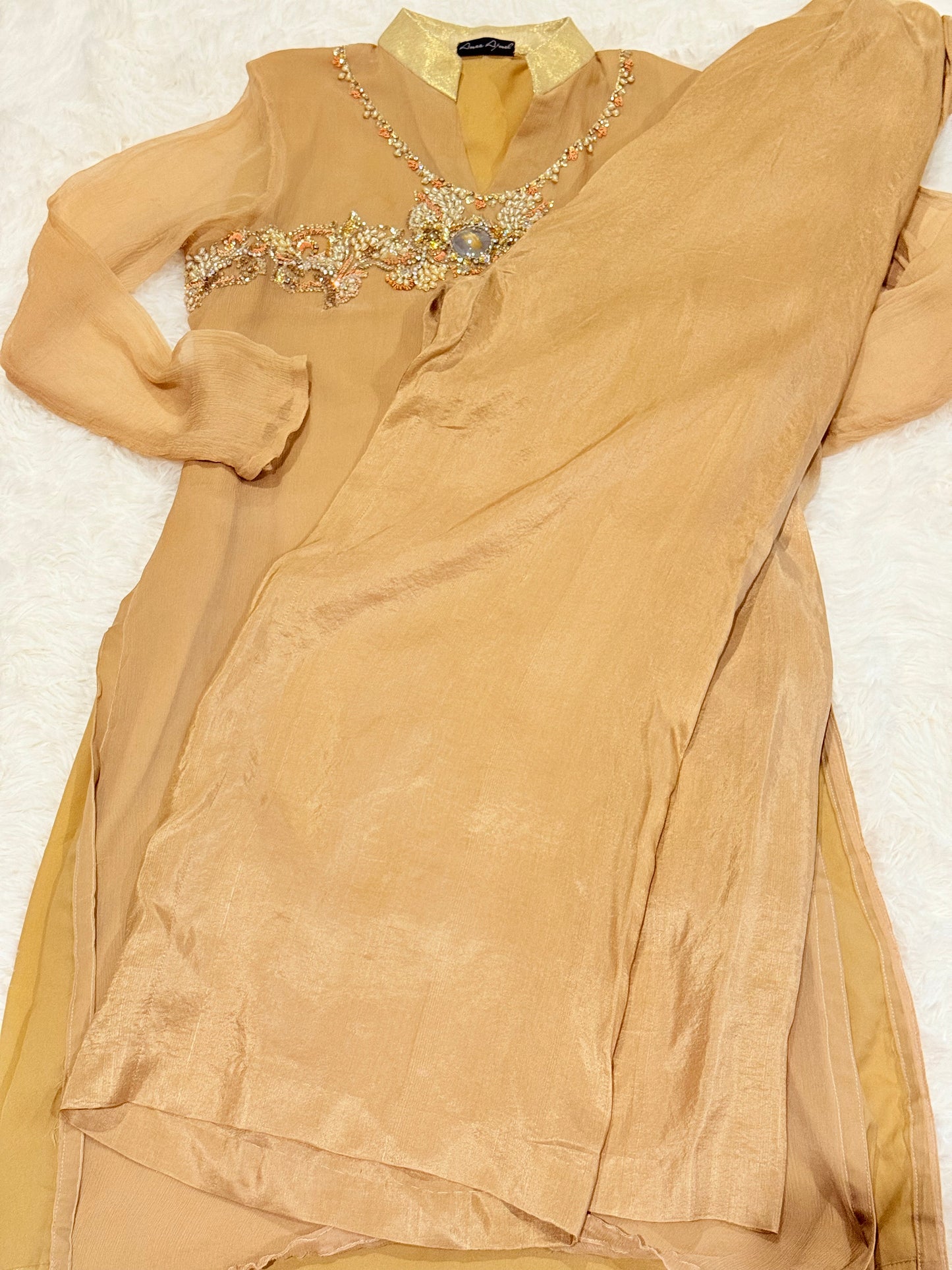 Amna Ajmal Couture Chiffon Lux Shirt in Beige color with heavy stone embellishments, comes with matching wide leg trouser in silk
