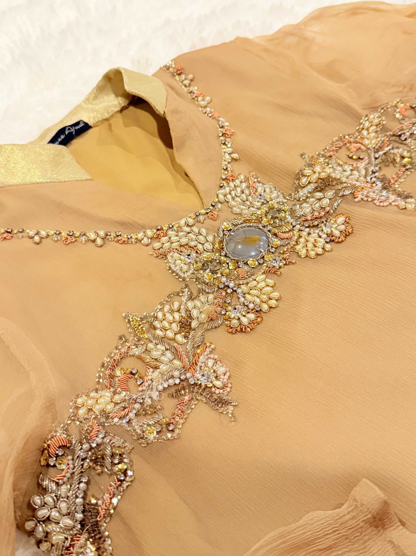 Amna Ajmal Couture Chiffon Lux Shirt in Beige color with heavy stone embellishments, comes with matching wide leg trouser in silk