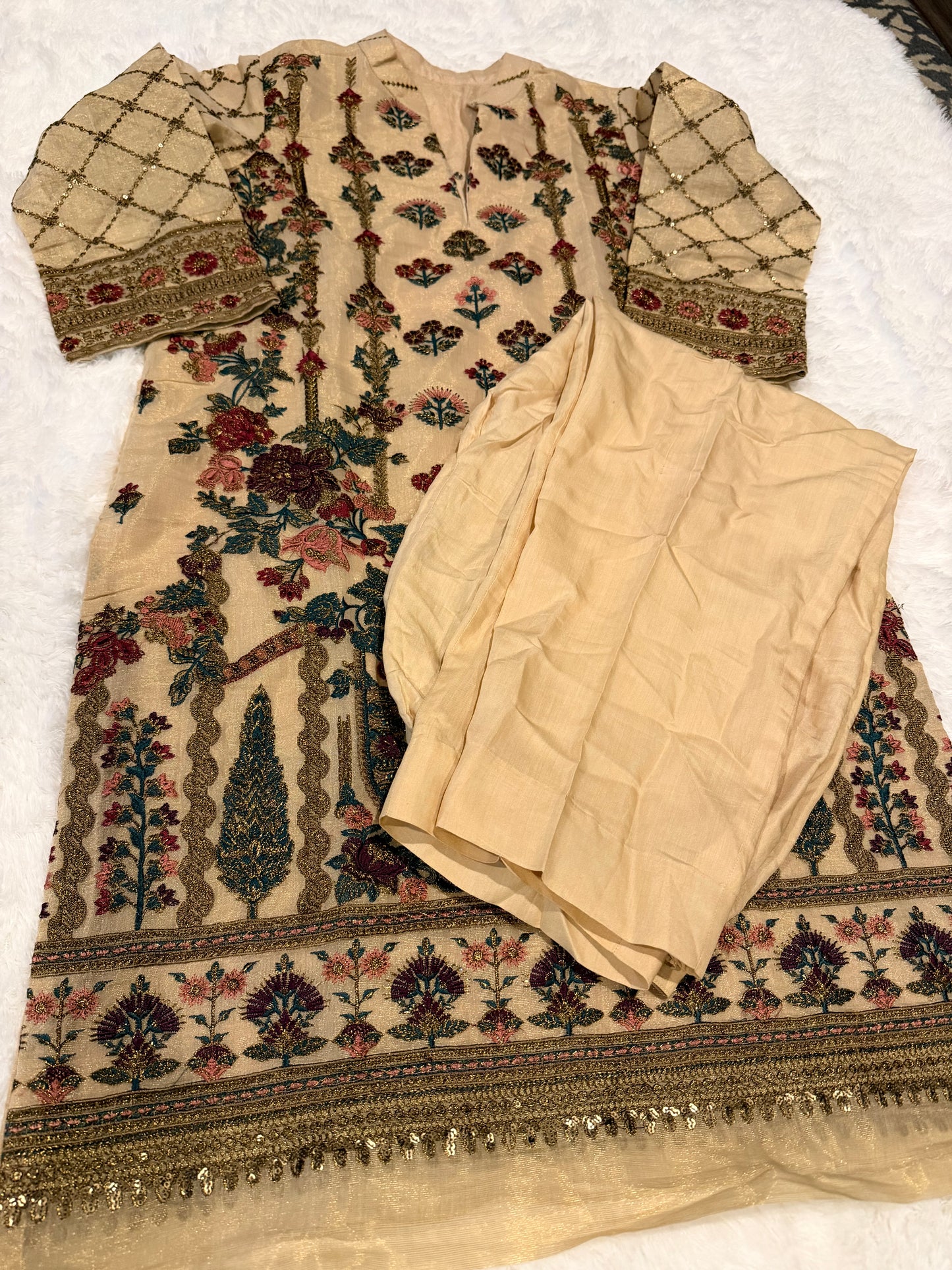 Heavily Embroidered Unbranded Golden Suit with Maroon, Pink, Green and Golden Embelishments.