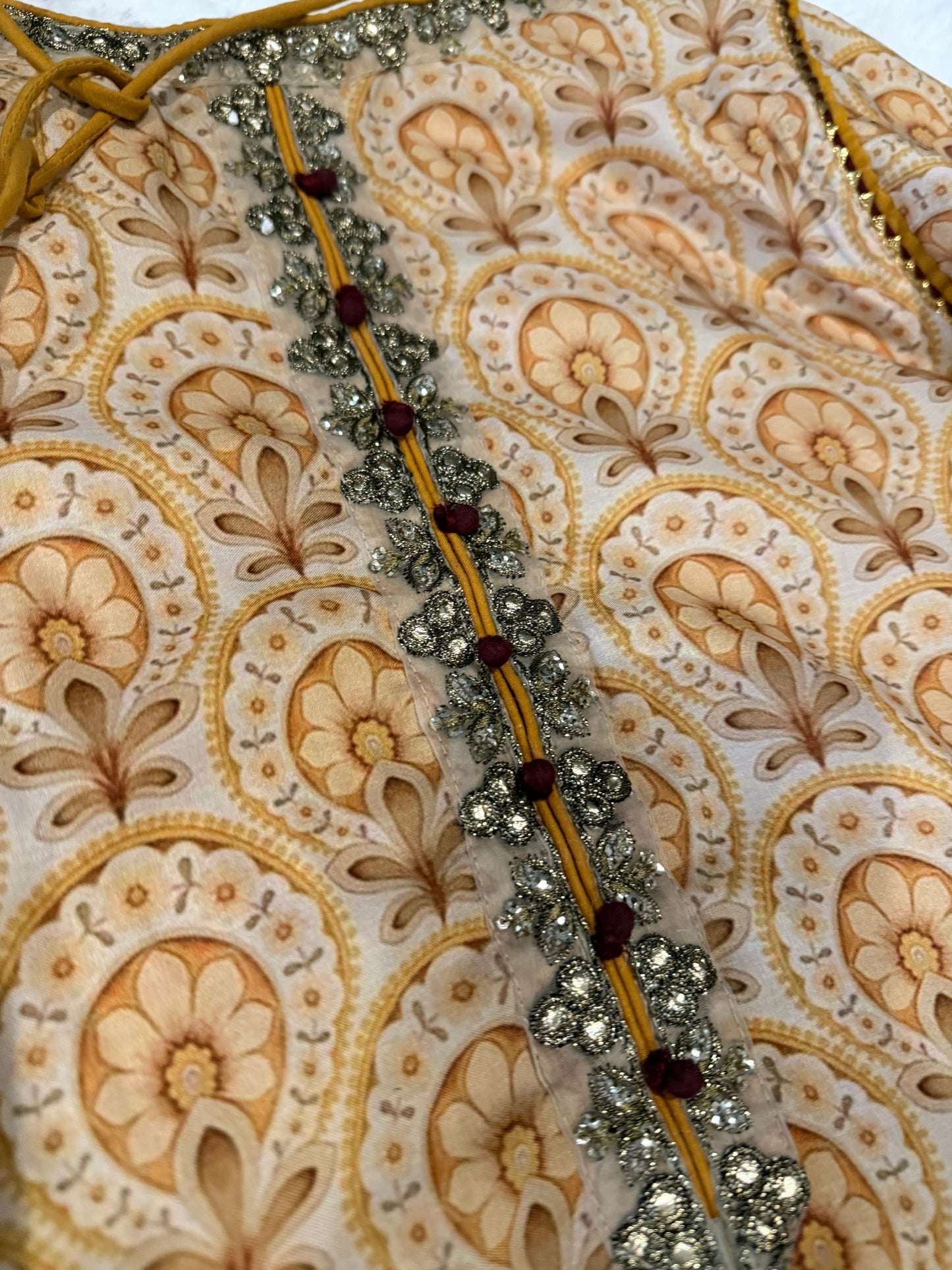 Vanya Mustard Yellow Colored Anarkali style shirt with ties.