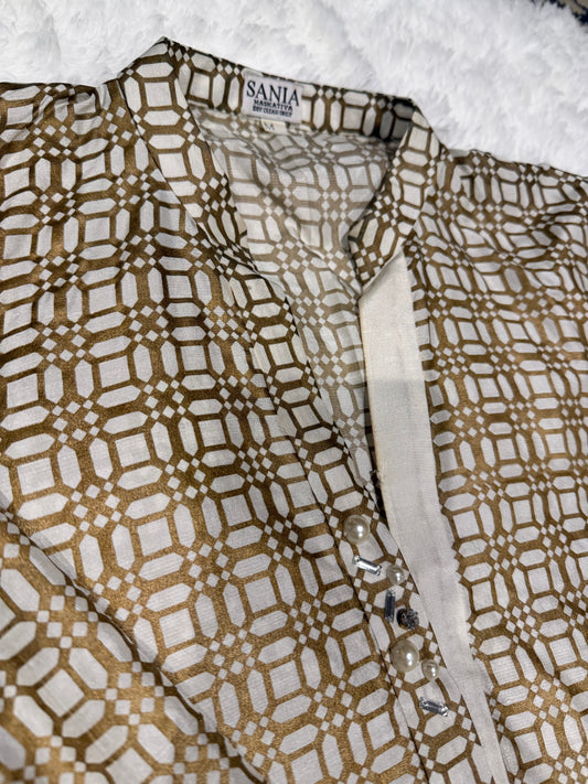 Sania Maskatiya Silk Block Printed Kurta style shirt with different front hem length and signature Sania embellishments on neckline.