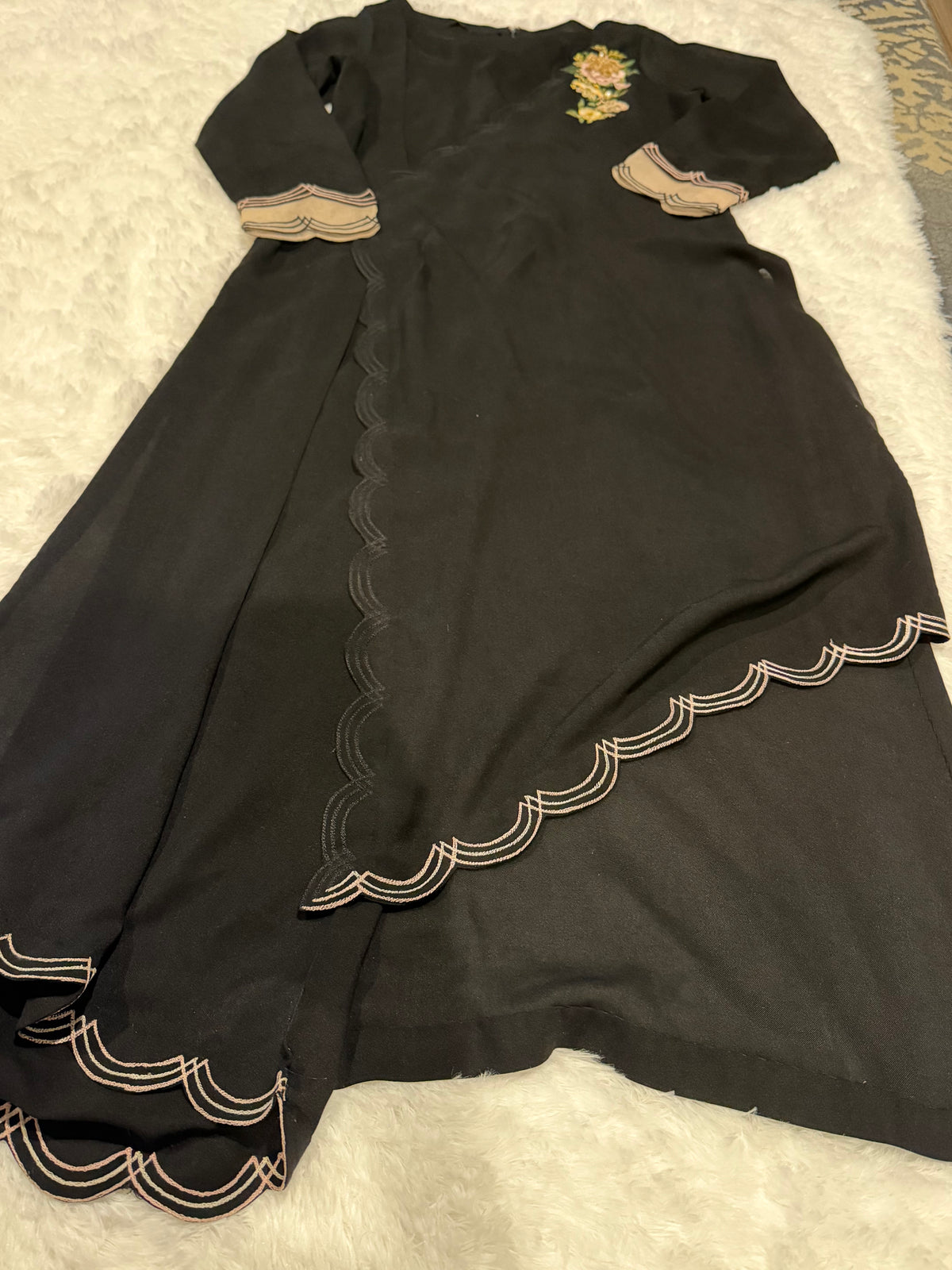 Asifa & Nabeel Long Black Shirt with Assymetric Hemline, Embroidery on front Hem and organza edged sleeves. Lovely floral embroidery near neckline