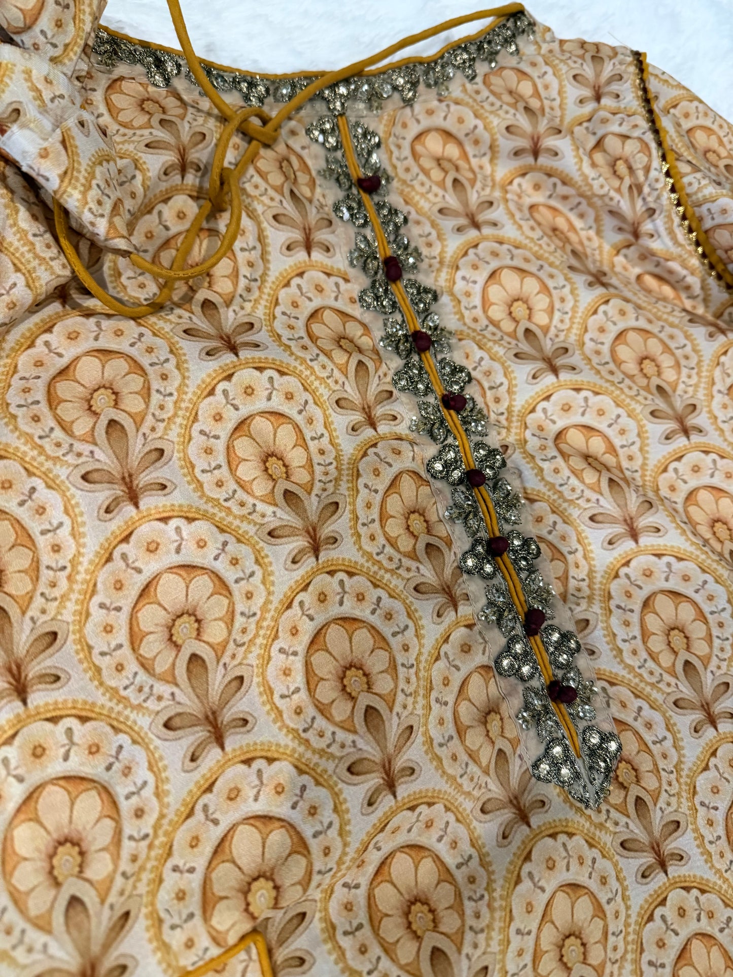 Vanya Mustard Yellow Colored Anarkali style shirt with ties.