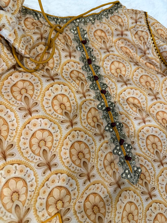 Vanya Mustard Yellow Colored Anarkali style shirt with ties.