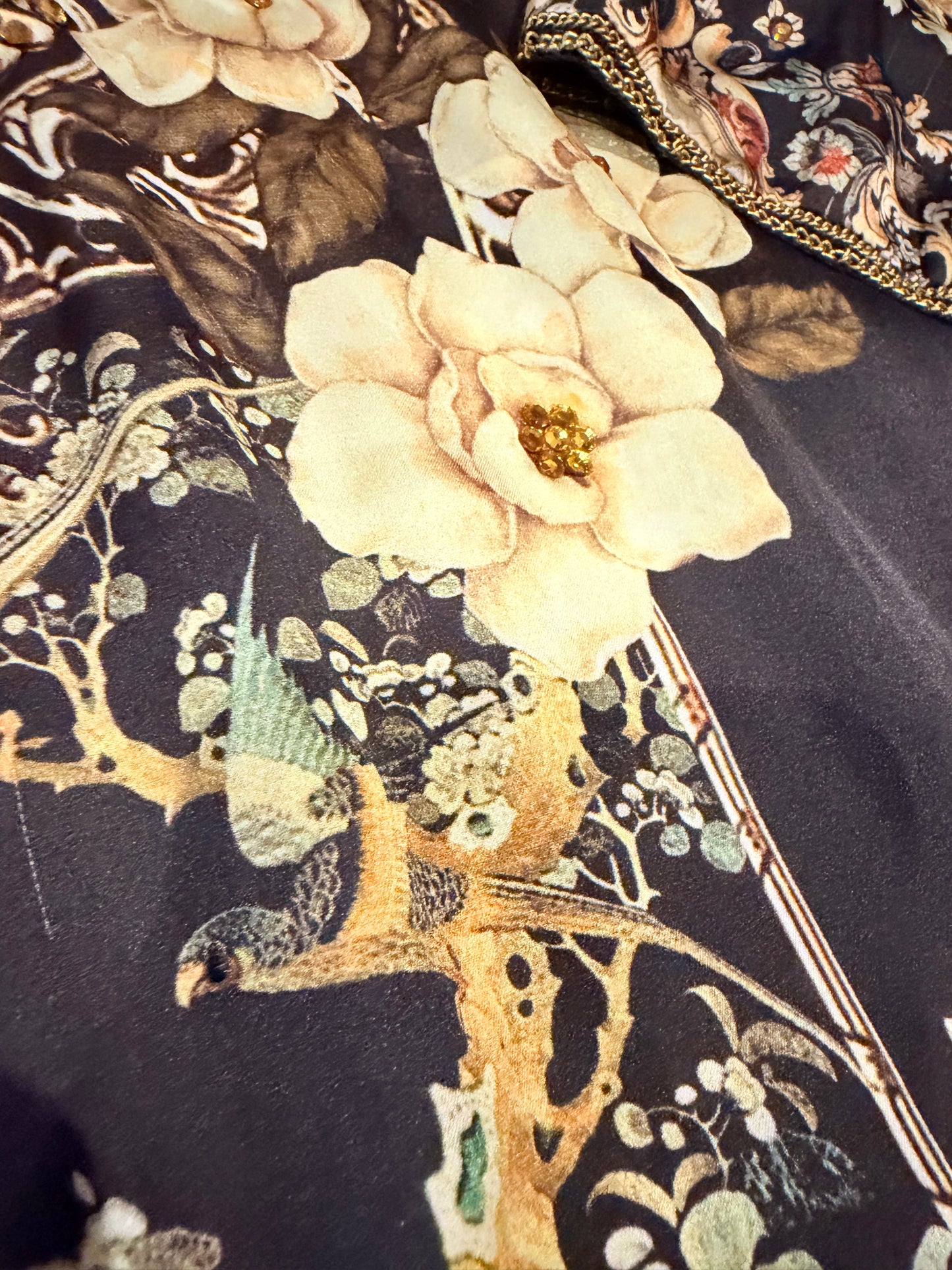 Sapphire Silk Black Shirt with Sequins spread throughout shirt and heavy embellishments around neckline.