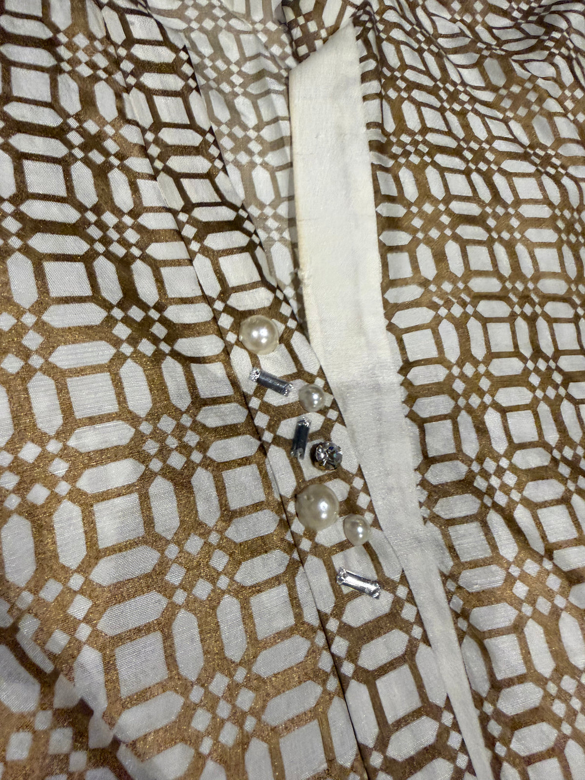 Sania Maskatiya Silk Block Printed Kurta style shirt with different front hem length and signature Sania embellishments on neckline.