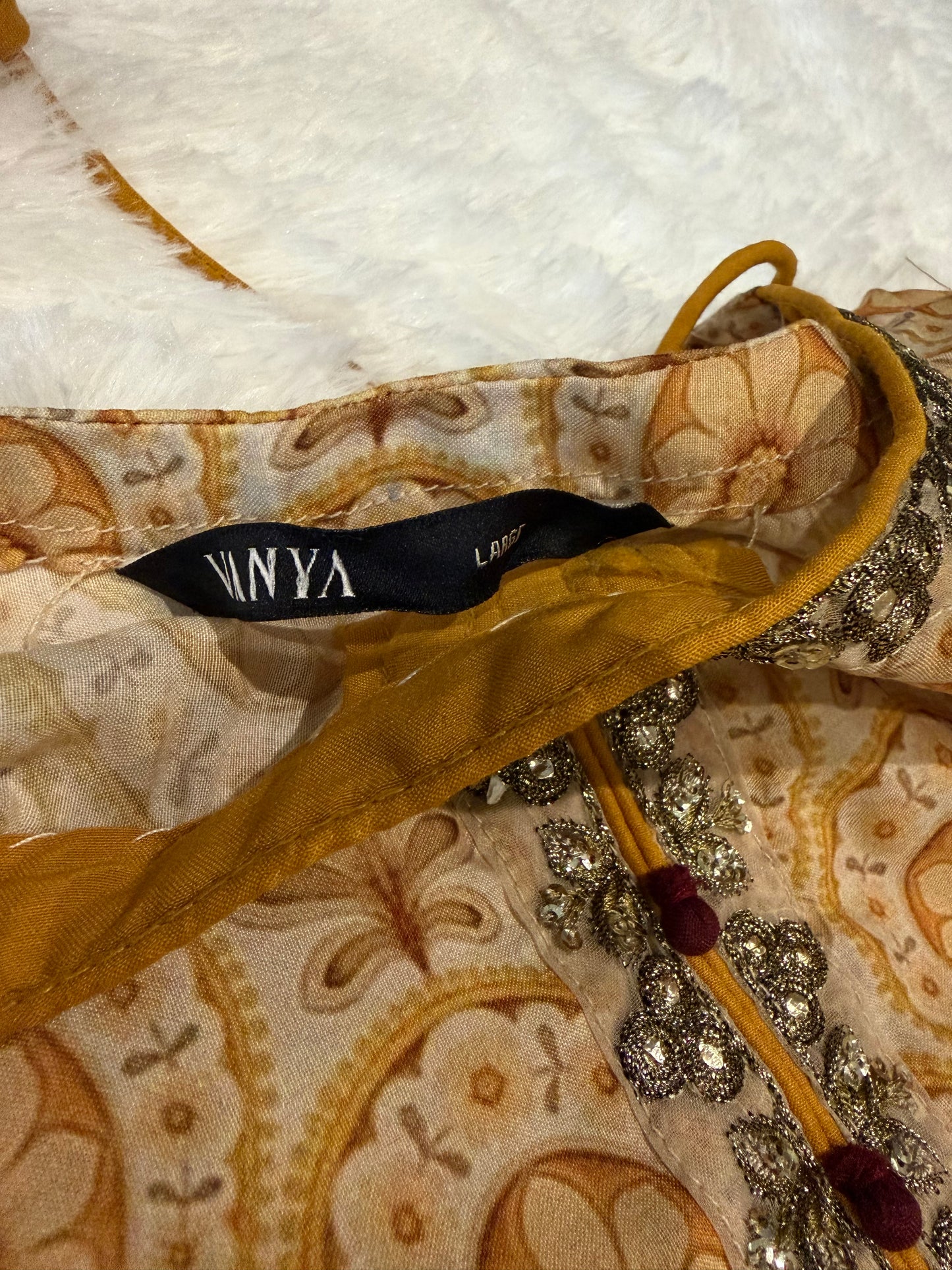 Vanya Mustard Yellow Colored Anarkali style shirt with ties.