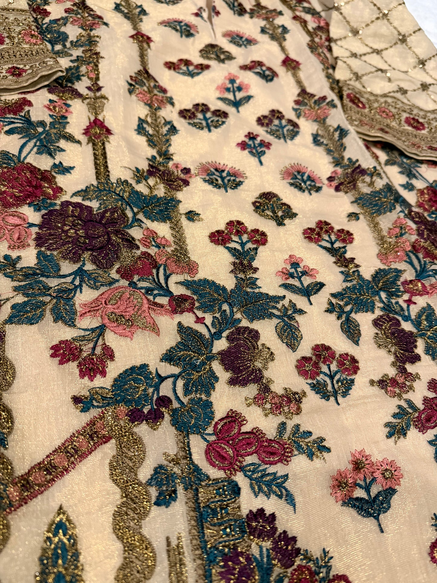 Heavily Embroidered Unbranded Golden Suit with Maroon, Pink, Green and Golden Embelishments.